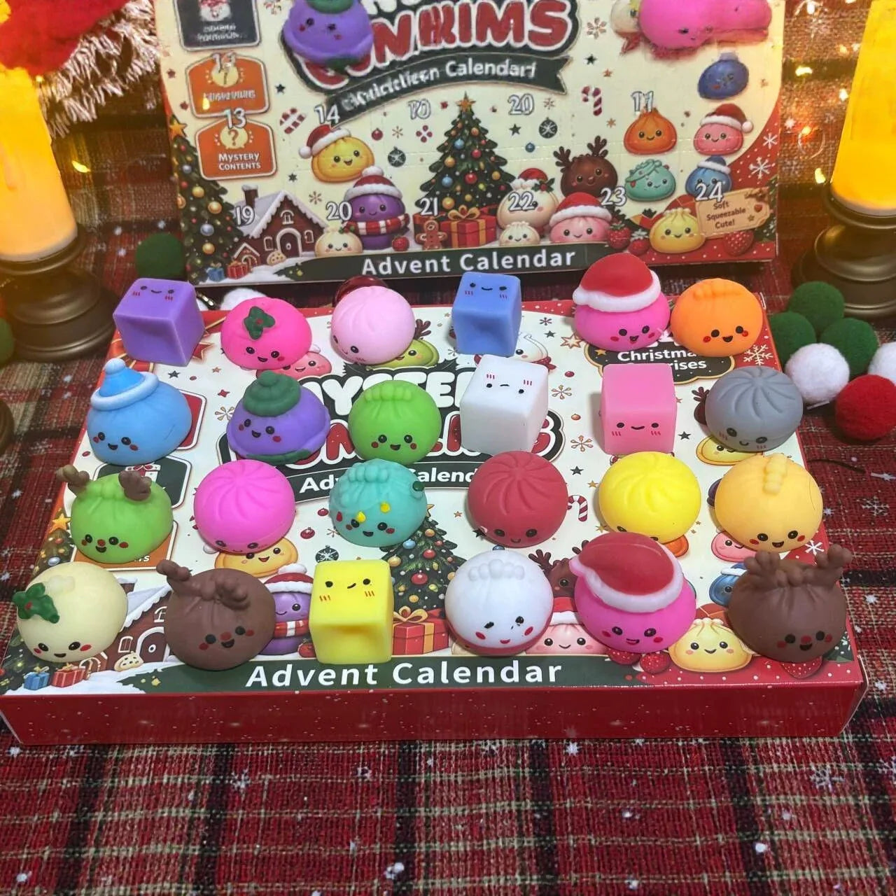 Opened fidget toy advent calendar showing 24 squishies including dumpling and cube shapes