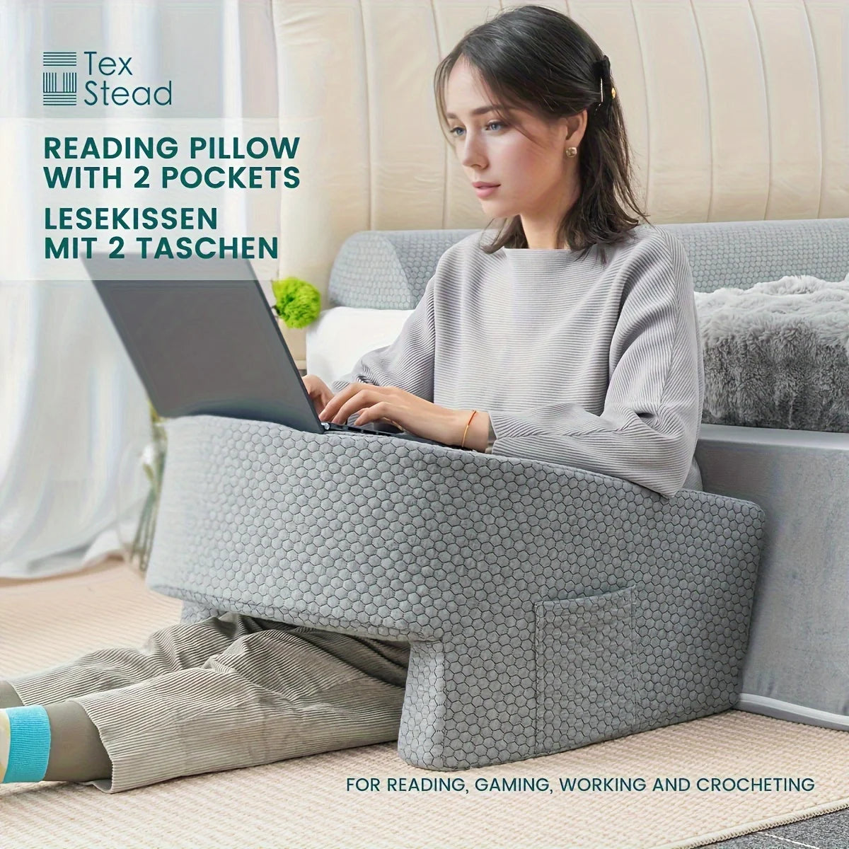 Woman using a reading pillow with two pockets on a couch, with Tex Stead branding.