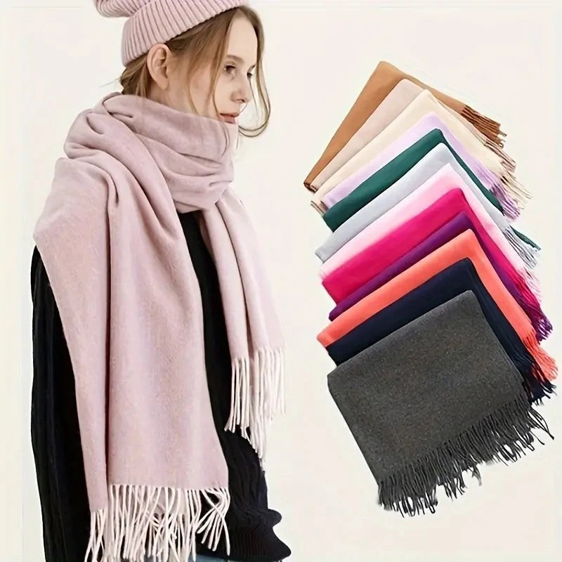 Woman wearing an oversized cashmere-feel scarf with a stack of colours