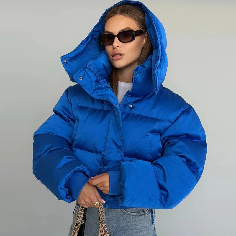 Woman wearing the Blue hooded cropped bubble puffer jacket, front view